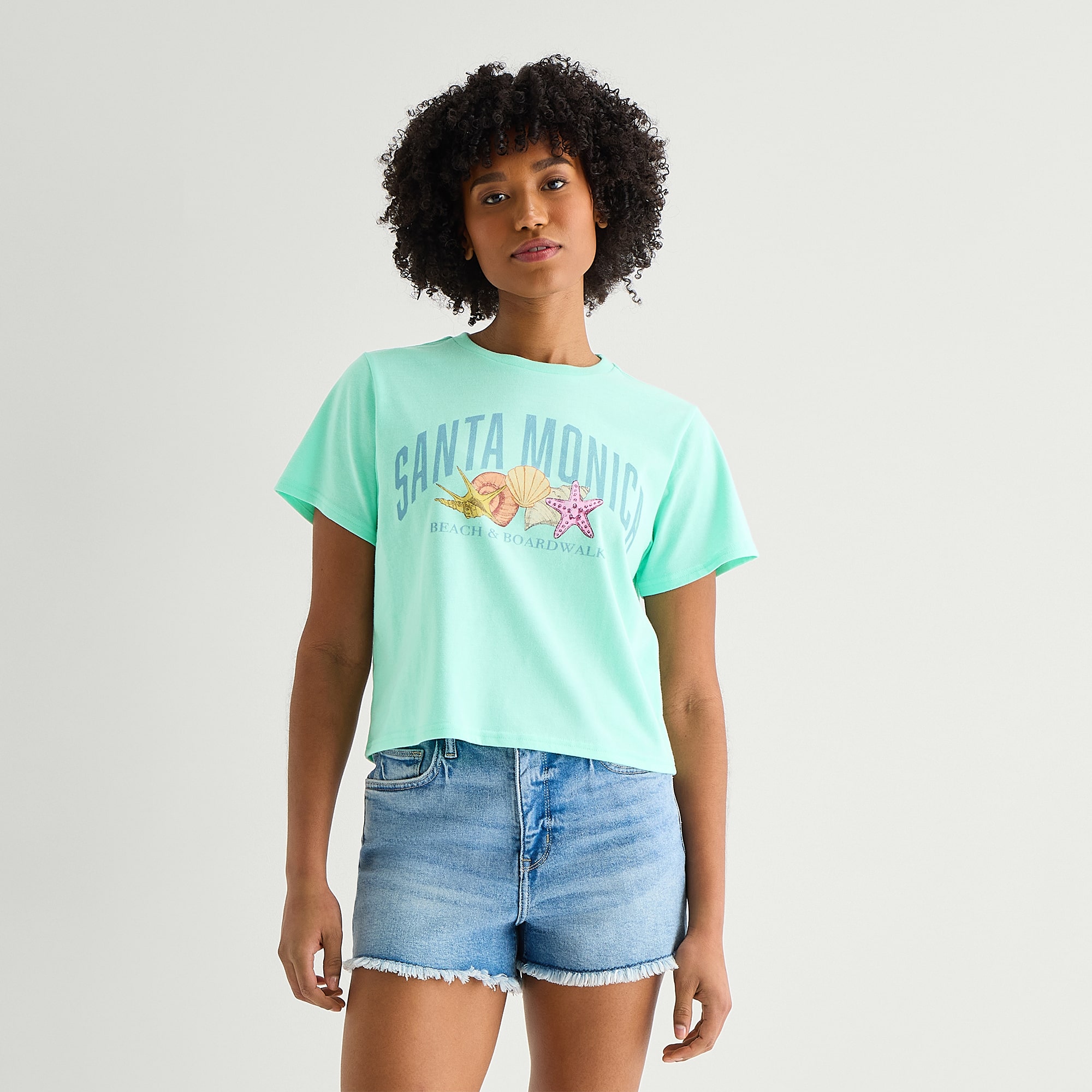 New World Santa Monica Baby Womens Juniors Crew Neck Short Sleeve Classic Fit Graphic T-Shirt