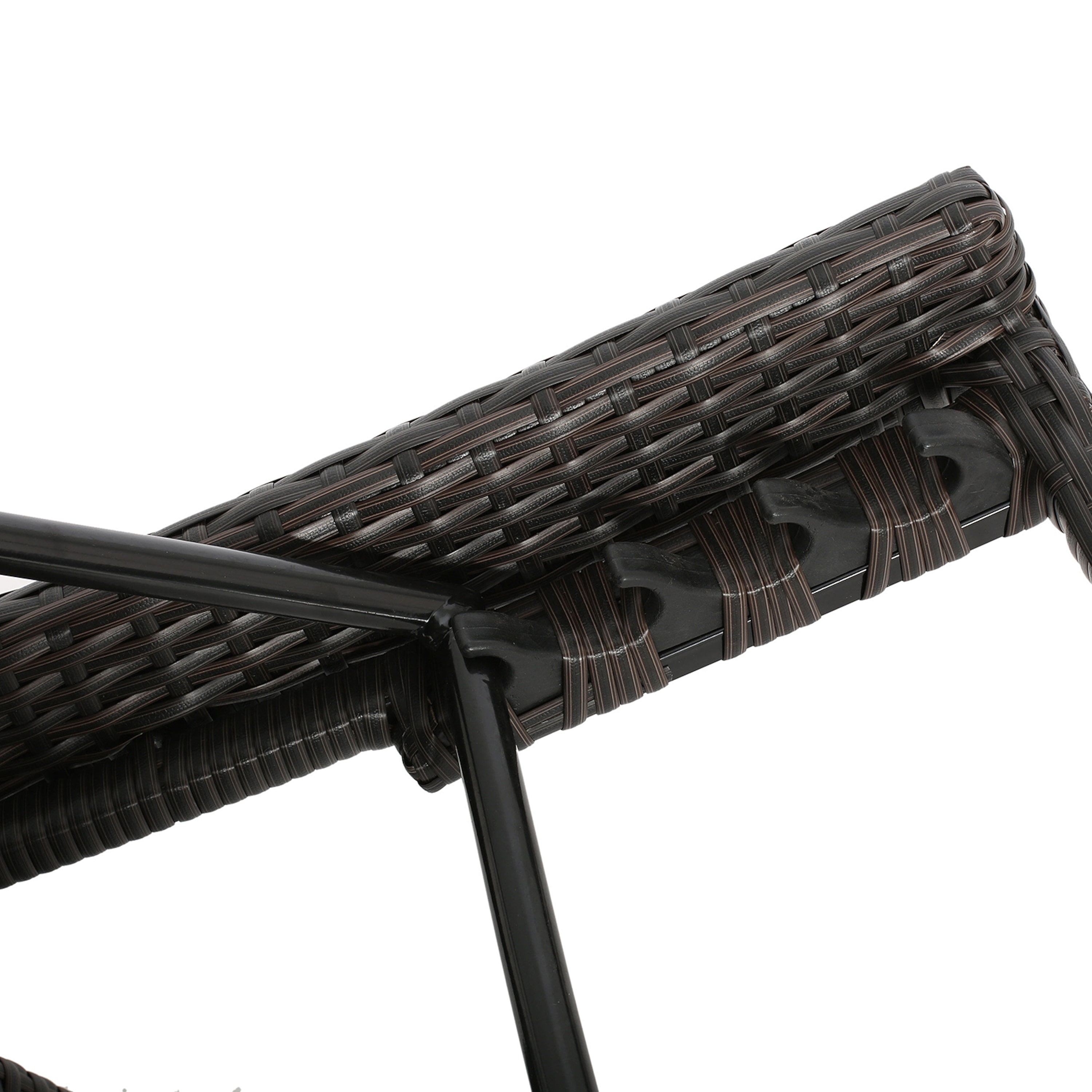 Close-up of the dark brown woven wicker material of the chair.