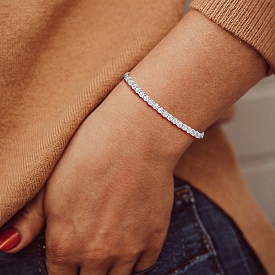 1/10 CT. T.W. Natural White Diamond Bolo Bracelet in Sterling Silver or 14K Gold Over Silver