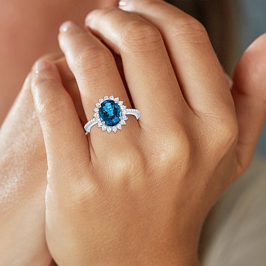 Womens Genuine Blue Topaz Sterling Silver Oval Halo Side Stone Cocktail Ring