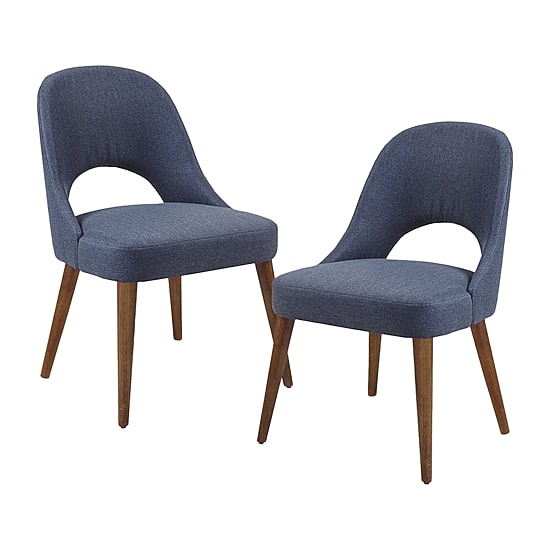 Two navy blue upholstered dining chairs with wooden legs against a white background.