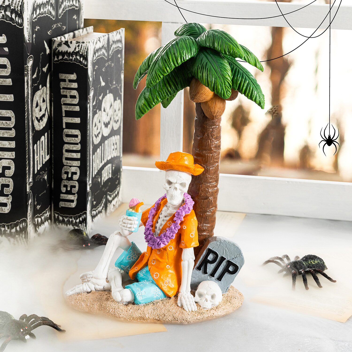 Glitzhome 12" Polyresin Skeleton On Beach Halloween Tabletop Decor
