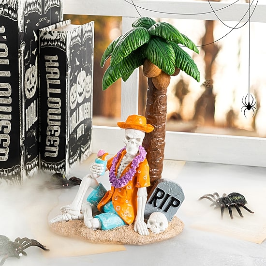 Glitzhome 12" Polyresin Skeleton On Beach Tabletop Decor