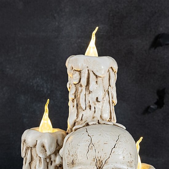 Glitzhome 15" Resin Skulls With Candles Tabletop Decor